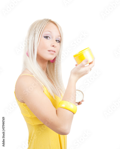 girl with yellow cosmetic container © JackF