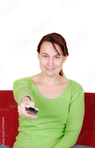 Young woman with remote control