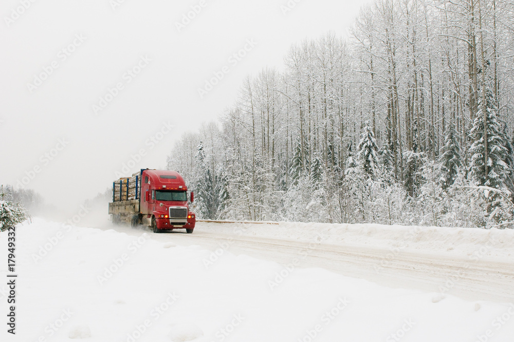 red truck on winter road