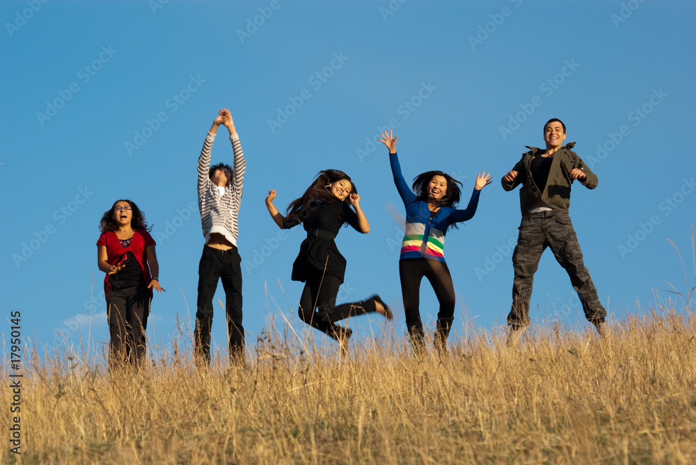 Group of young asian beautiful people jumping for joy Group of young asian beautiful people jumping for joy