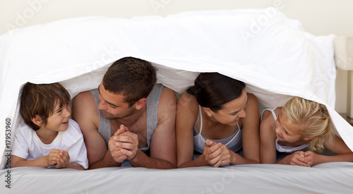 Family talking under the sheets