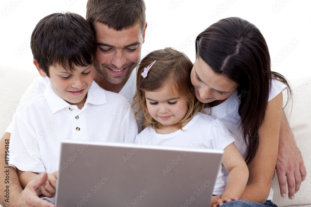 Young family using a laptop at home Young family using a laptop at home