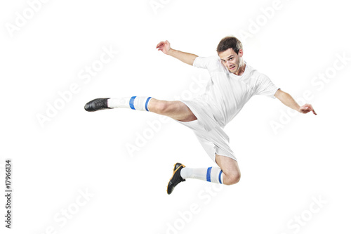Soccer player in a jump isolated on white background