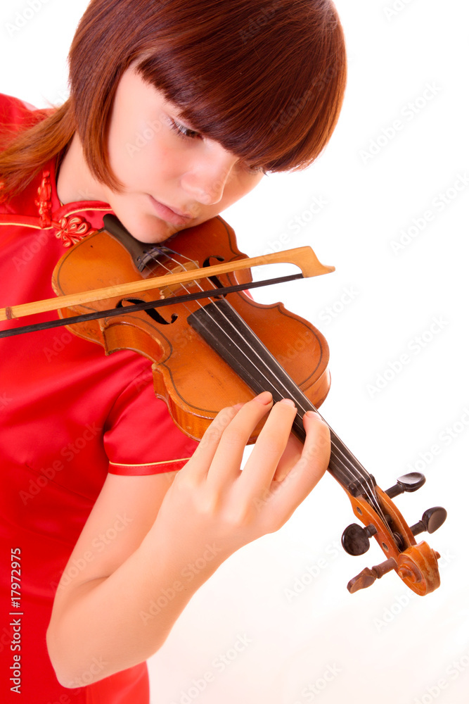 Young artist with play violin isolated on white Young artist with play violin isolated on white