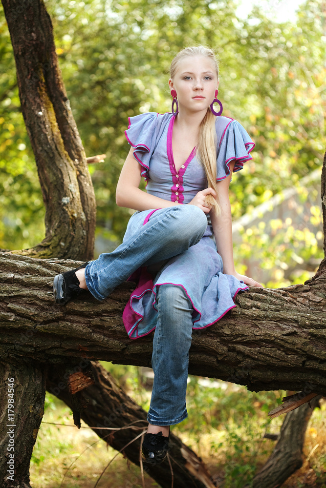 Pretty young girl on a tree Pretty young girl on a tree