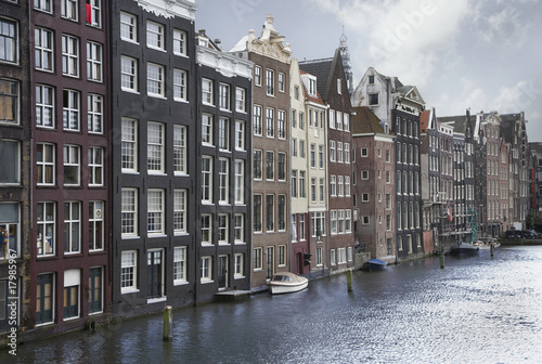 Amsterdam canals and typical houses on a blue sunny day © Alexey Kuznetsov