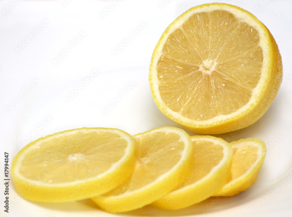 half of lemon and lemon slices half of lemon and lemon slices