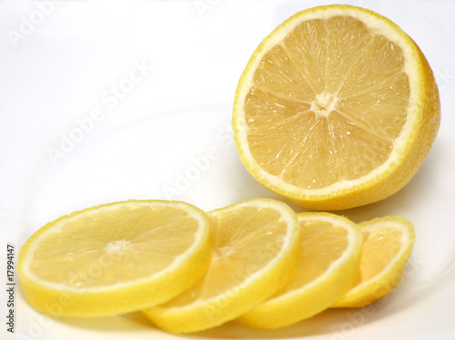half of lemon and lemon slices