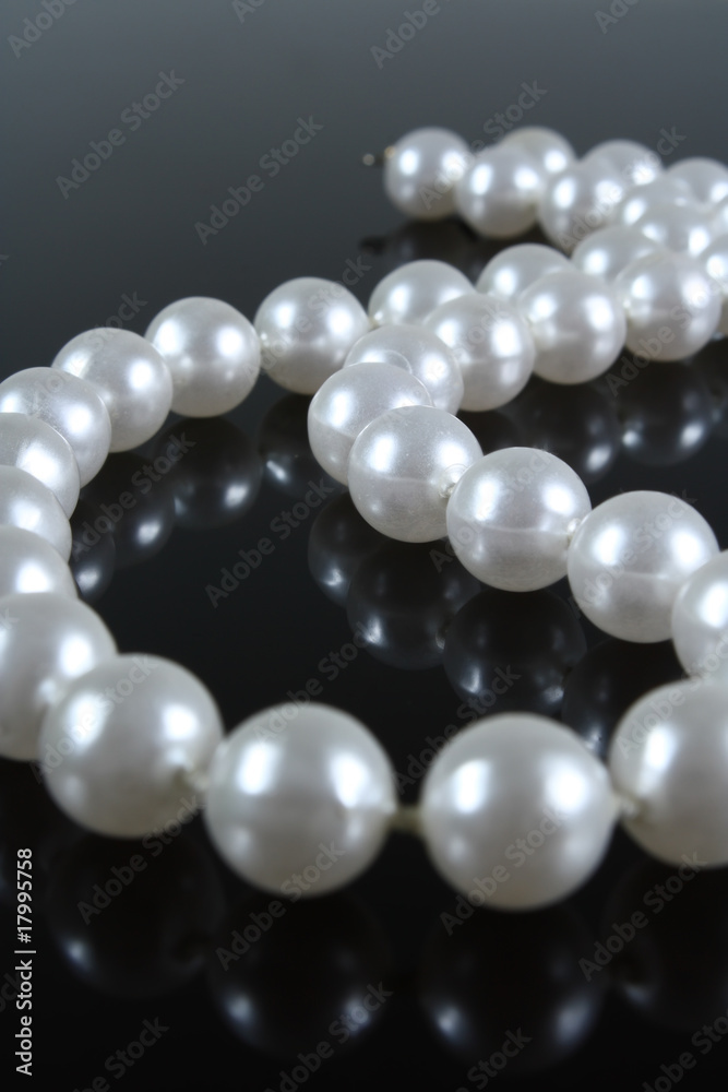 pearl necklace on a dark background with reflection pearl necklace on a dark background with reflection