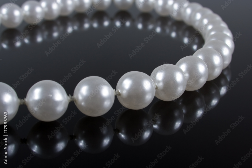 pearl necklace on a dark background with reflection pearl necklace on a dark background with reflection