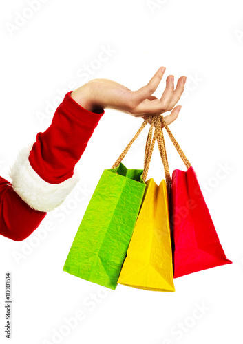 hand with three shopping bags