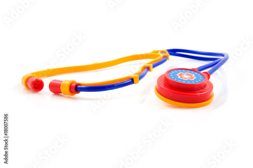 Plastic stethoscope for children over white background