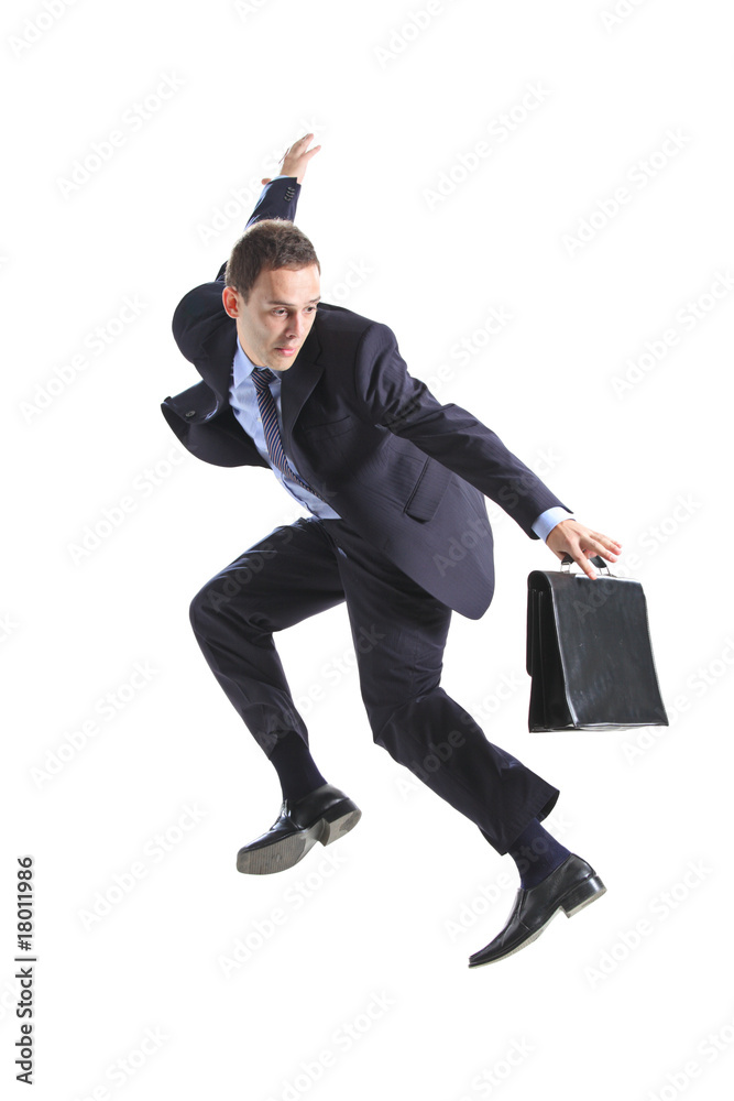 Young businessman with a briefcase jumping Young businessman with a briefcase jumping