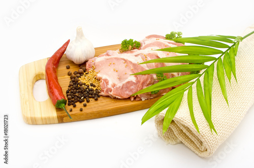 hunks of meat with spices isolated on white