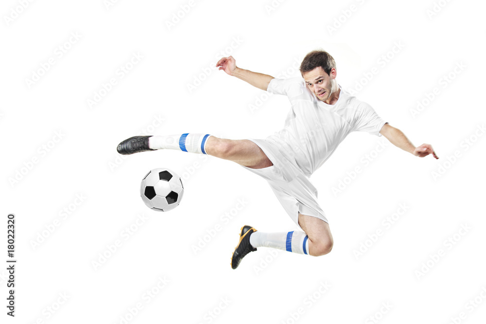 Soccer player with a ball in action isolated on white