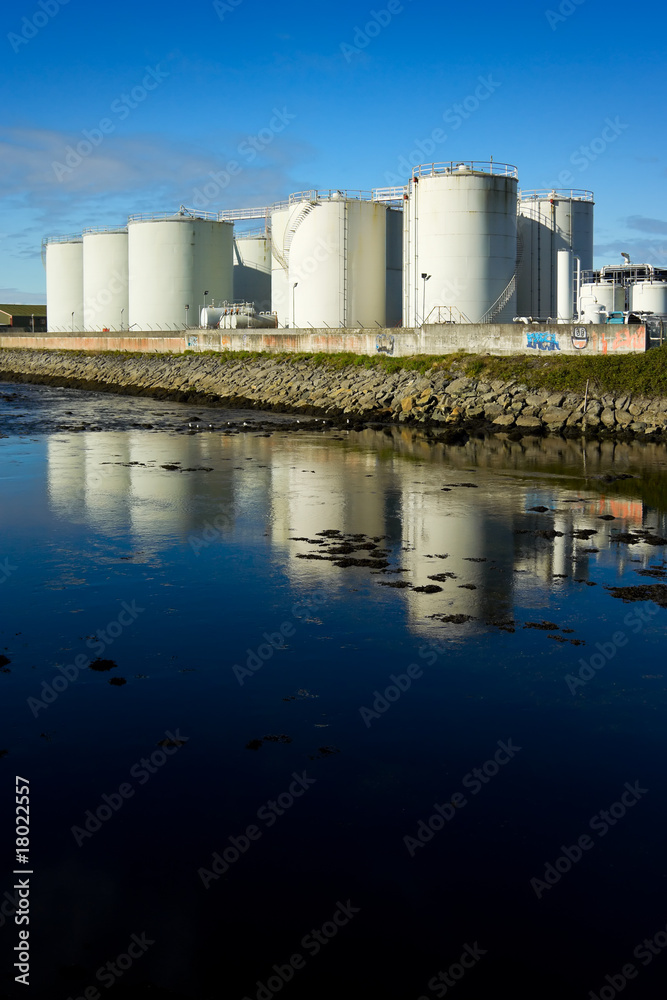 fuel tanks on the bank of the river