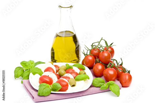 caprese - Italian salad with cherry tomatos, olives and mozarell