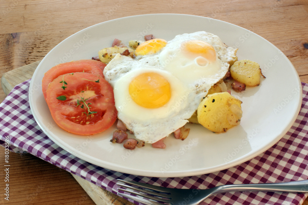 fried egg with organic potato and tomato fried egg with organic potato and tomato