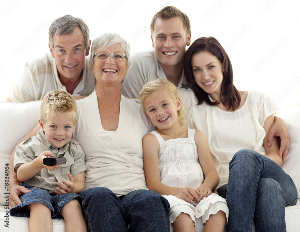 Happy family watching television in living-room Happy family watching television in living-room