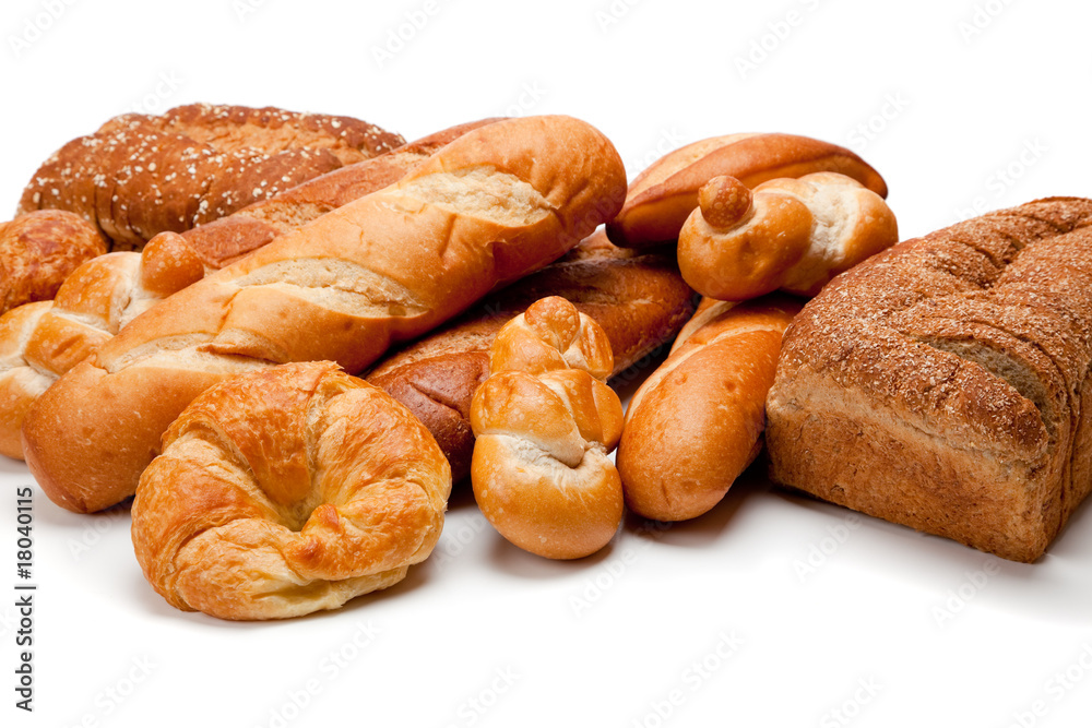 Assorted kinds of breads on a white background