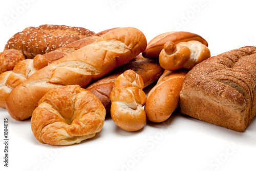 Assorted kinds of breads on a white background
