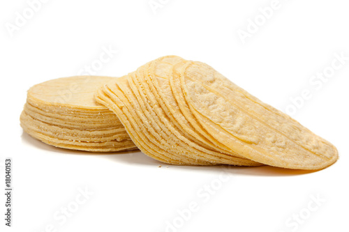 Stack of corn tortillas on white