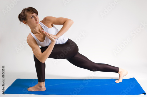 young yoga girl doing yogatic exericise