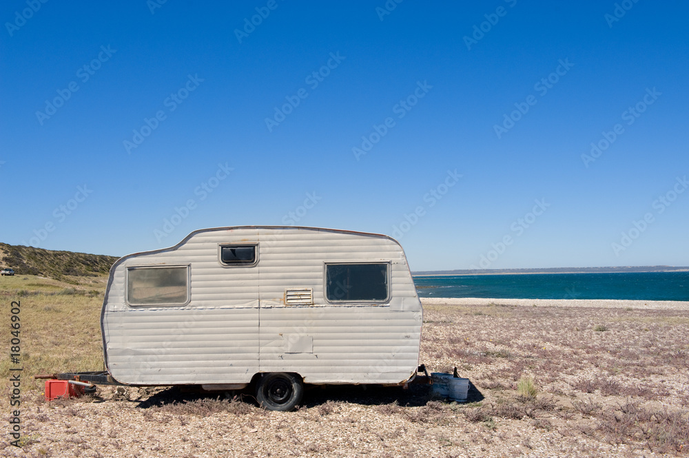 Lonely trailer by the shore. Lonely trailer by the shore.