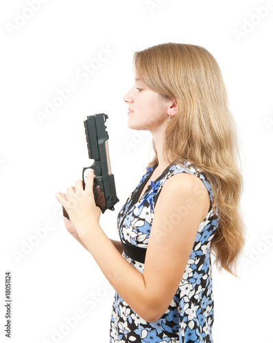 Shot of a beautiful girl holding gun over white