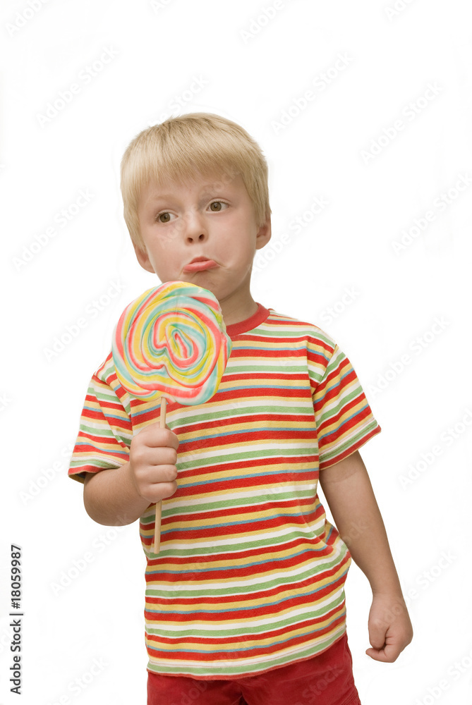 Ungrateful child holds really large lollipop Ungrateful child holds really large lollipop