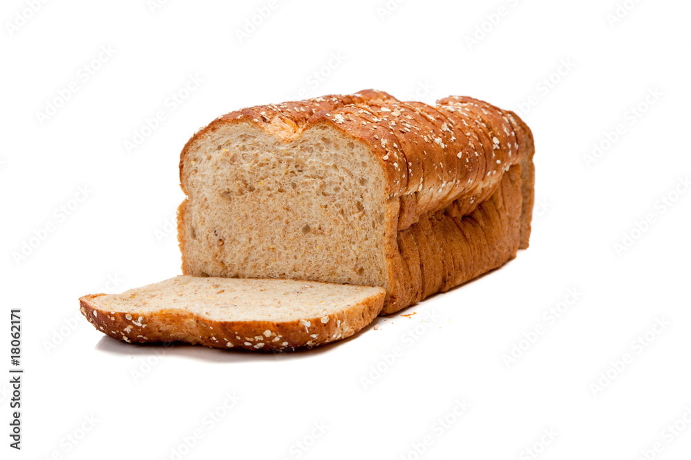 A loaf of whole grain bread on white