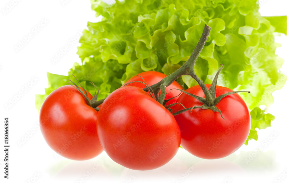 Ripe red tomatoes and green leaves of salad. Ripe red tomatoes and green leaves of salad.