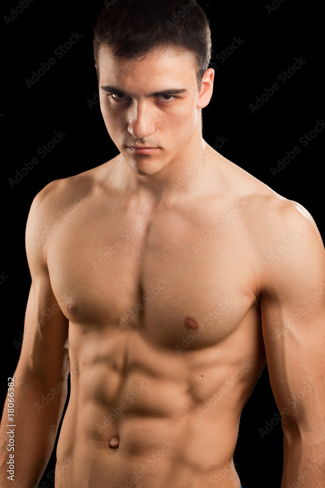 Sexy muscular man isolated on black