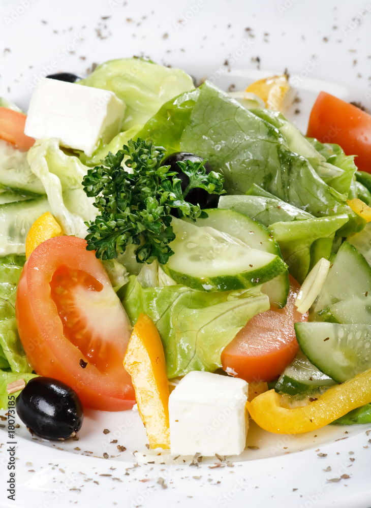 Caesar salad in a white plate. Caesar salad in a white plate.