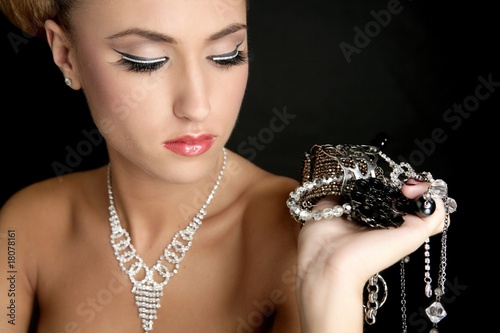 Fotografi Ambition and greed in fashion woman with jewelry