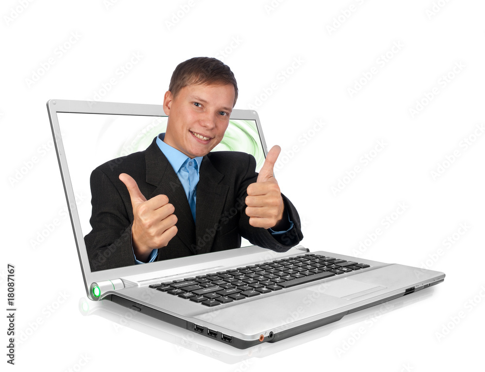 A handsome businessman with thumbs up through a laptop A handsome businessman with thumbs up through a laptop