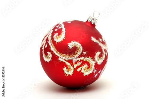 Red christmas ball with gold pattern isolated on white backgroun