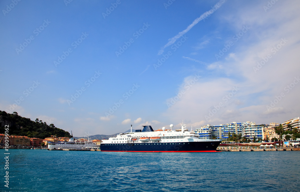 a cruise ship at harbor in the city of Nice