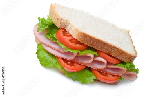 sandwich with sliced ham, tomatoes and lettuce leaves