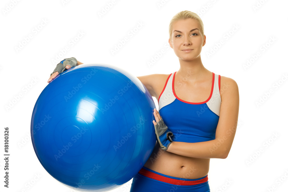 Happy trainer holding a fitness ball. Happy trainer holding a fitness ball.