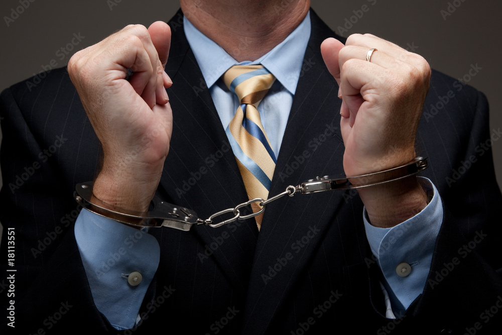 © Michael Flippo - Business man in handcuffs © Michael Flippo - Business man in handcuffs