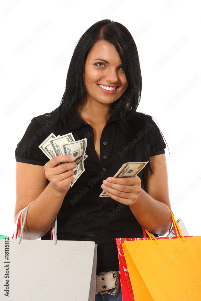 Young woman with money and shopping bags
