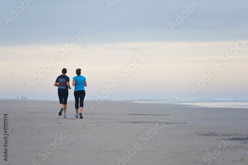Couple running on the beach © jo.weber