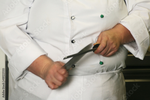 Chef Sharpening a Knife