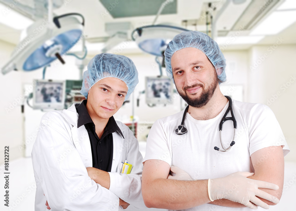 Two young doctors in surgery room