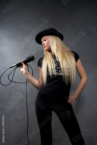 beautiful young blonde girl with microphone