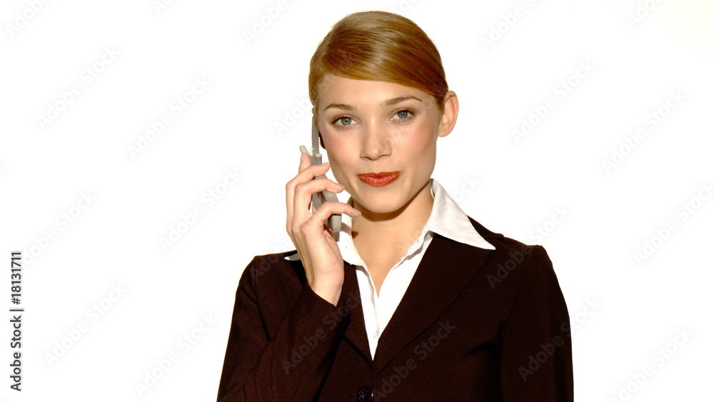 Beautiful young businesswoman is using mobile phone Beautiful young businesswoman is using mobile phone