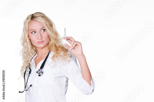 Portrait of a young female doctor holding an injector isolated