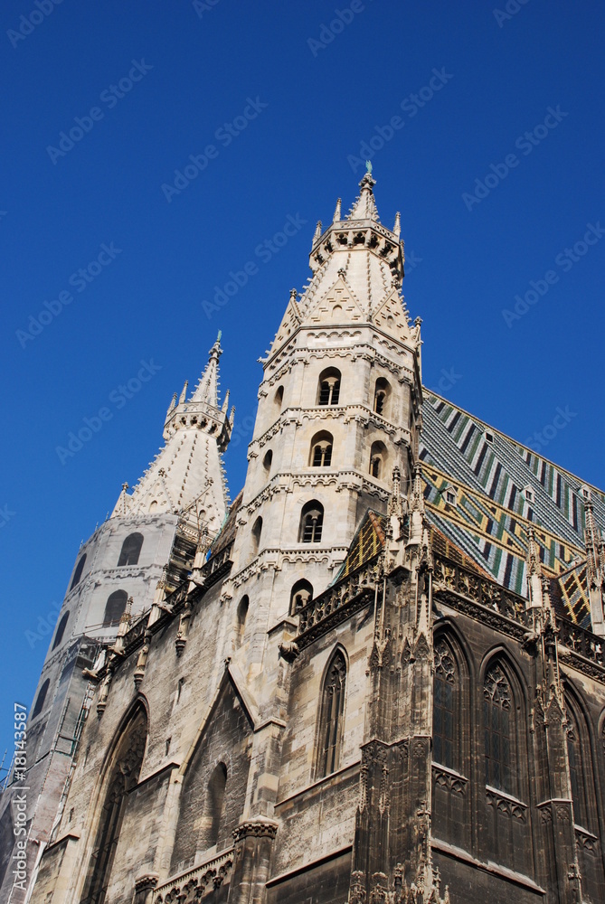 Fototapeta premium View of St. Stephen's Cathedral (Stephansdom) agains blue sky at Stephansplatz in Vienna, Austria, Europe.