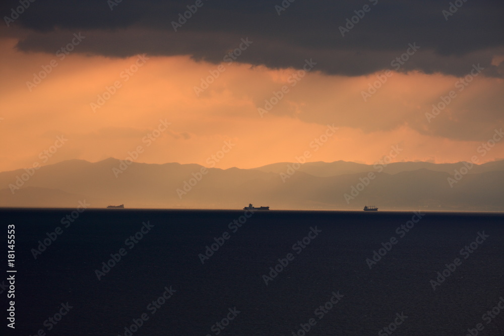 Tanker sailing at sunset